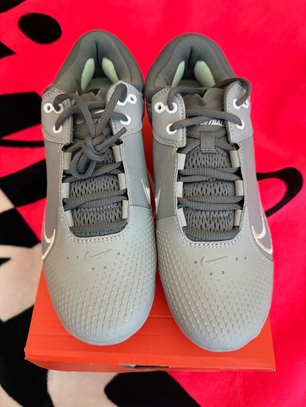Nike women’s Gray Lace-Up softball cleats